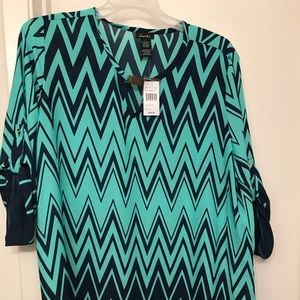 Polyester top never worn still has tags.